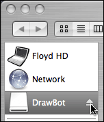 Mouse cursor hovering over eject button in background window, while Finder is also in background.
