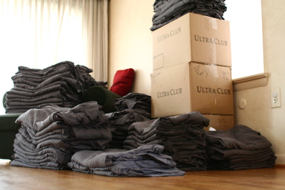 Pile of folded Daring Fireball t-shirts.