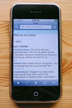 An iPhone displaying the m.twitter.com tweet list.