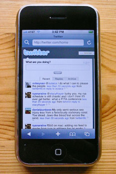 An iPhone displaying Twitter.com zoomed in to the width of the tweets column.