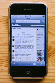 An iPhone displaying Twitter.com at default zooming scale.