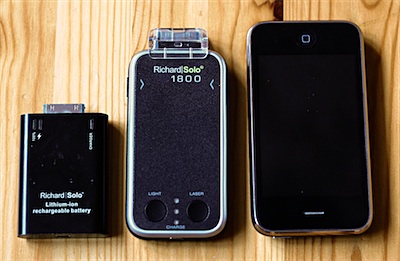The two Richard Solo backup batteries, side-by-side with an iPhone 3G.