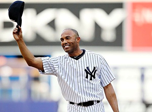 Mariano Rivera tips his cap to the fans after recording his record-breaking 602nd regular season save.