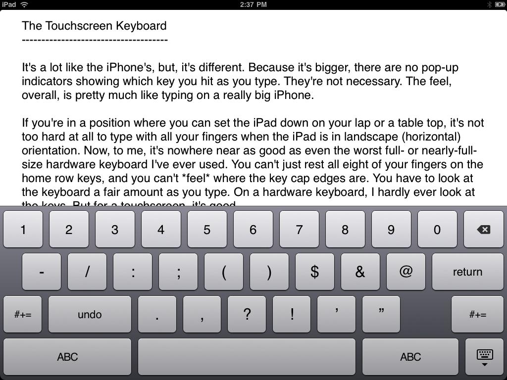 Screenshot of the iPad keyboard, numeric/punctuation mode.