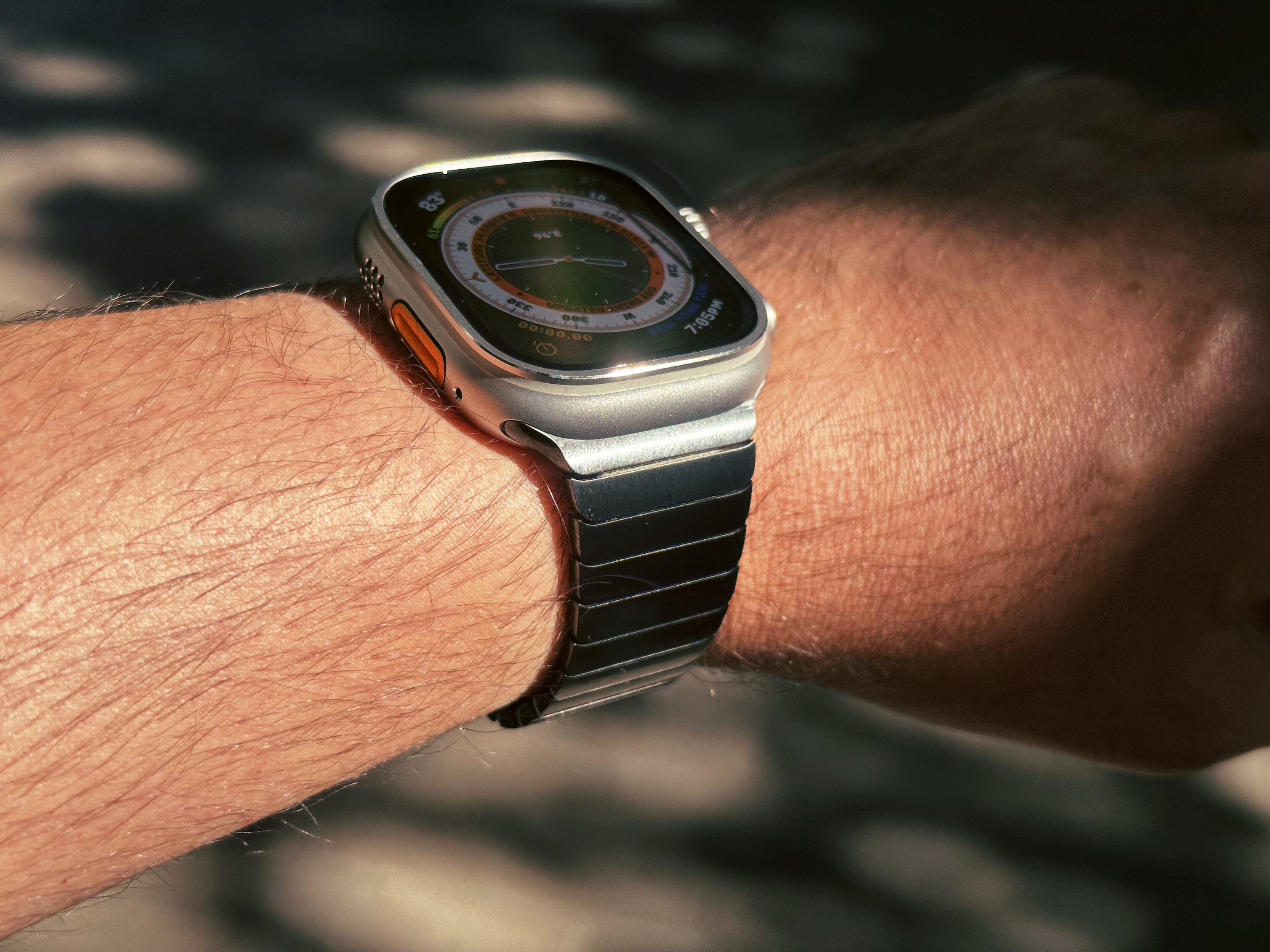 Apple Watch Ultra, paired with a space black Link Bracelet.